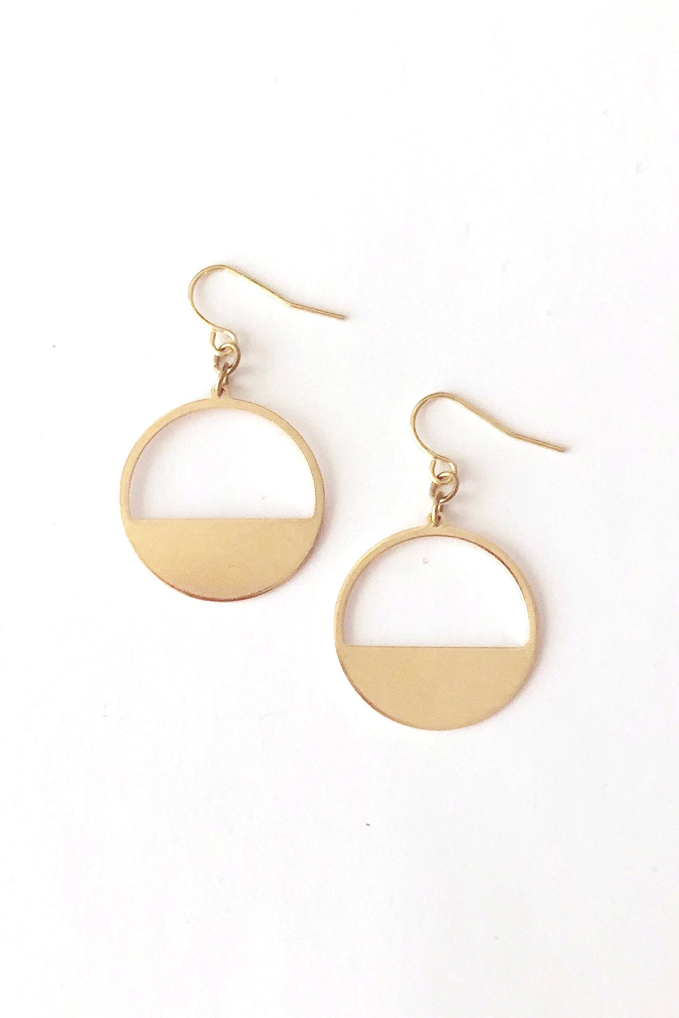 Bilke earrings by Darlings of Denmark; raw brass; hollow semi circle; short dangle earrings; flat lay